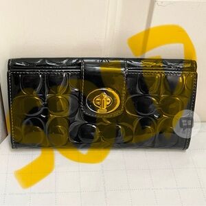 SOLD. Authentic Coach embossed leather signature monogram long wallet